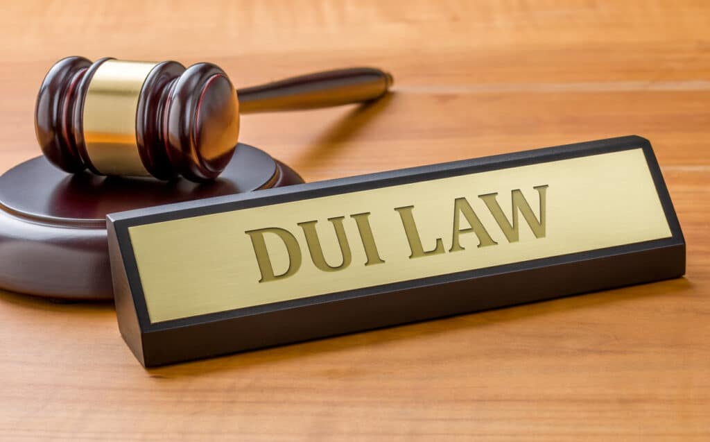 A gavel and a name plates that says "DUI Law"