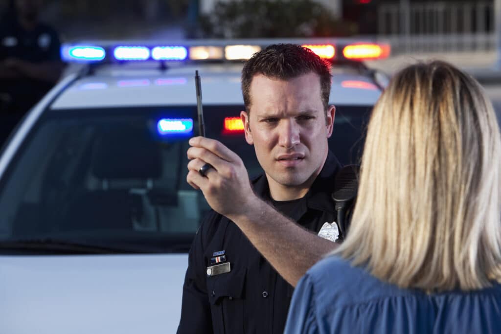 A police officer administering the HGN field sobriety test